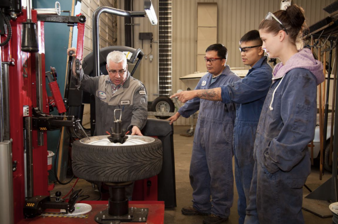 students in auto mechanics class